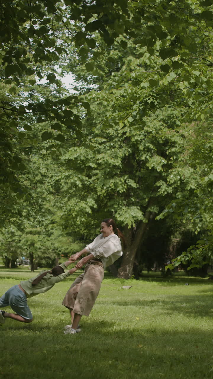 Woman and child playing in the park