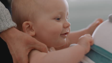 cute-baby-learning-to-walk-with-mother-holding-toddler-helping-child-stand-teaching-balance-at-home