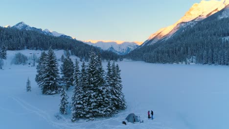 tourist standing near the tent on snow covered landscape 4k