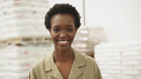 Portrait-of-young-woman-working-in-a-warehouse-strore-room-4k