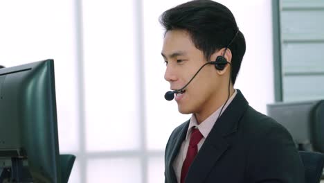 Business-people-wearing-headset-working-in-office