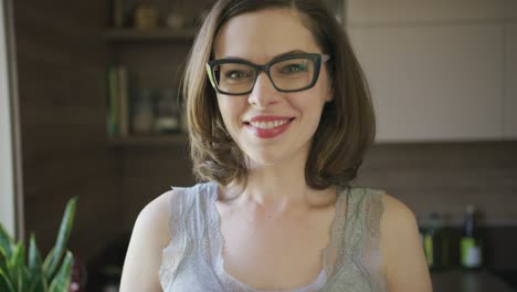 Smiling-beautiful-woman-in-eyeglasses-at-home