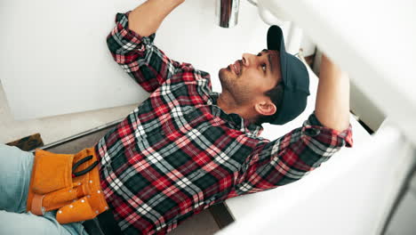 plumber repairing sink plumbing