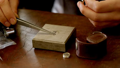 female jewelry designer working in workshop 4k