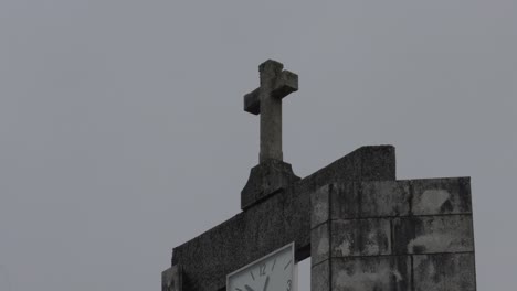 stone cross on a building