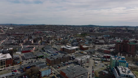 Fly-above-urban-neighbourhood-in-large-city.-Aerial-panoramic-shot-of-town-development.--Boston,-USA