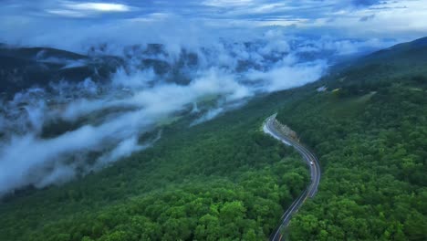 aerial drone video footage of a scenic highway in the appalachian mountains during summer. this is in the shawangunk mountains which are a subrange of the appalachians in new york's hudson valley.
