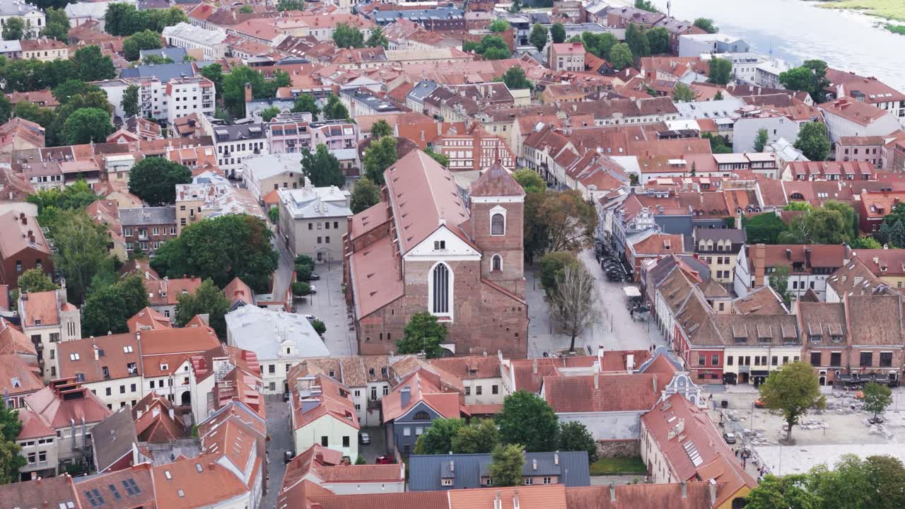 Kaunas city cathedral and downtown rooftops, aerial view