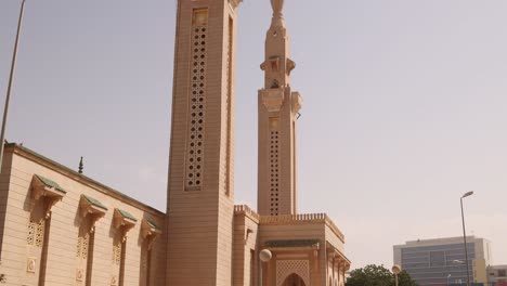 tilt up of the tower of saudi mosque, nouakchott capital city of mauritania