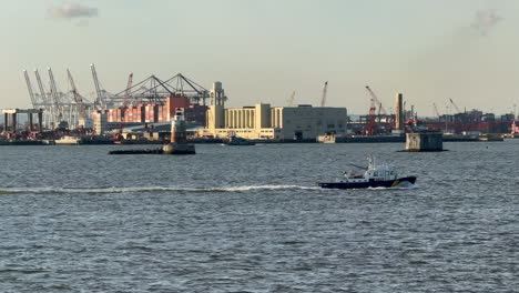 boats passing by the seaport, blue sky with clouds, recorded in nyc