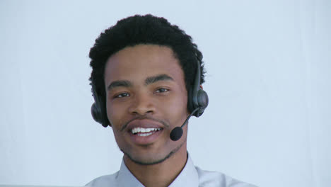 Portrait-of-businessman-talking-on-a-headset