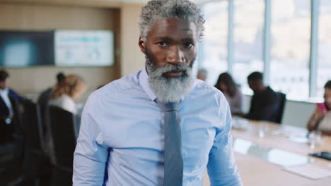 portrait-mature-african-american-businessman-executive-looking-serious-confident-male-entrepreneur-with-corporate-experience-in-leadership-proud-manager-in-office-boardroom-4k