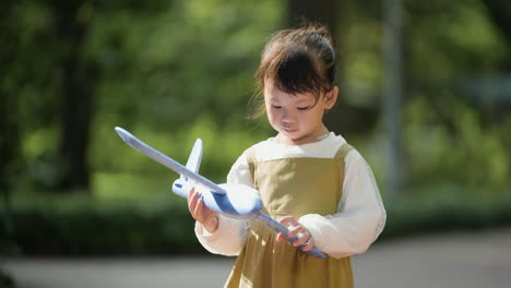 Child-with-blue-airplane