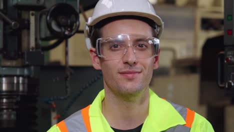 young factory worker or engineer close up portrait in factory