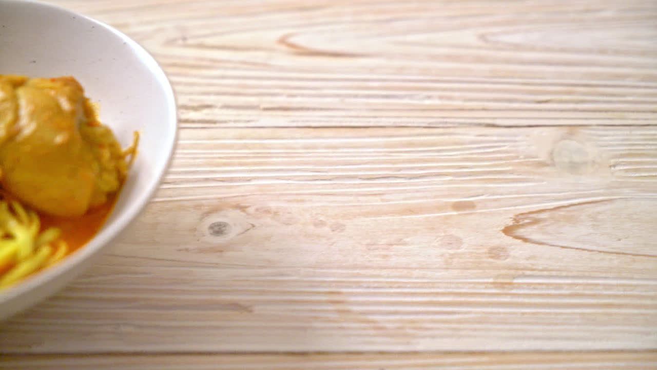 Northern Thai noodle curry soup with chicken (Kao Soi Kai) - Thai food style