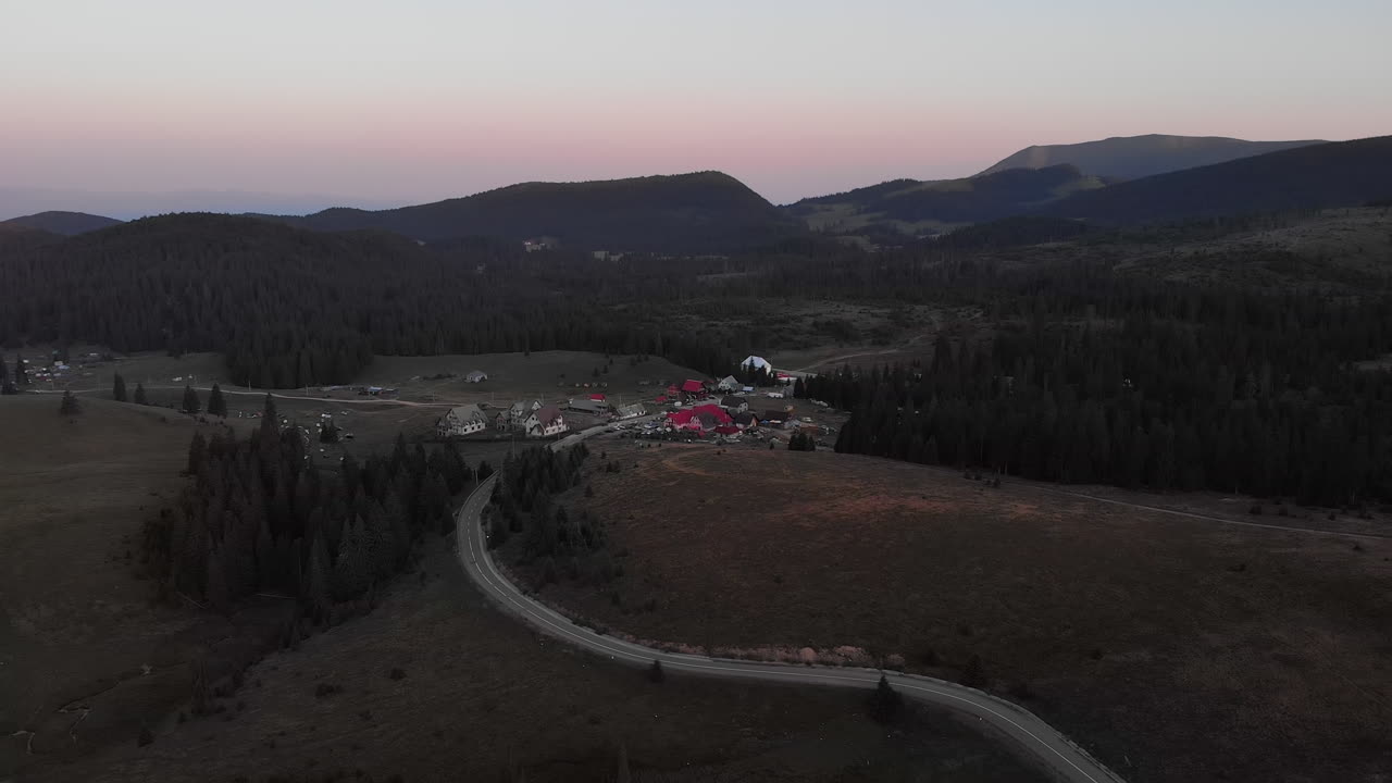 Aerial View of a Mountain Village at Sunset
