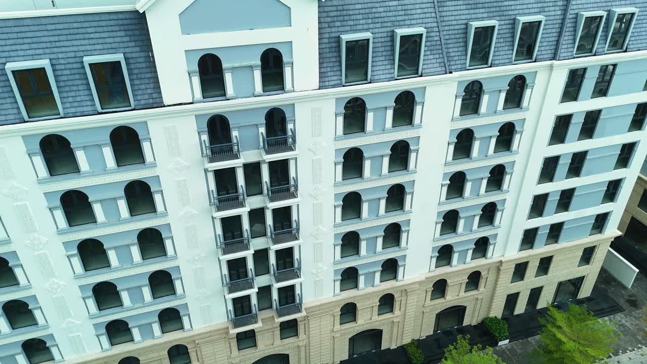 Aerial: Grand World fake Venice town, empty real estate during the day in Phu Quoc Island, Vietnam, crane down drone shot