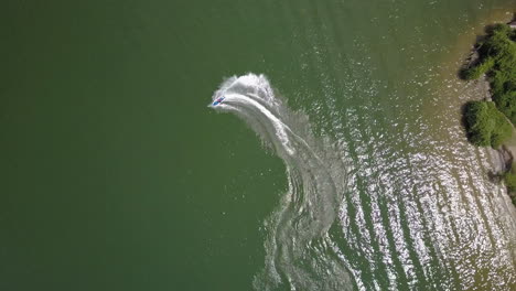 top down aerial view of person having fun on a jet ski