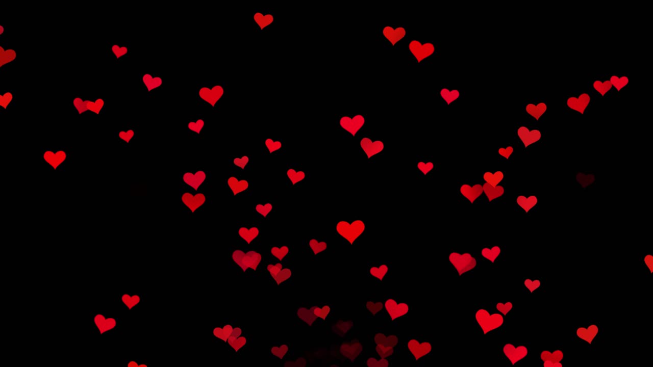 corazones rojos sobre fondo negro