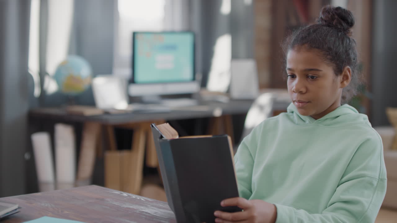 Little Afro Girl Reading Book At Home