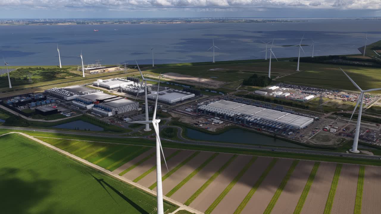 Massive data center, computing center, aerial video in the Eemshaven, The Netherlands. Aerial video