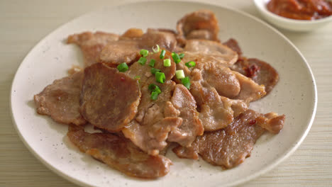 grilled pork neck sliced on plate in asian style