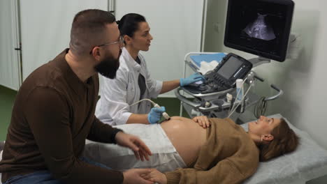 pregnant woman laying on stretcher