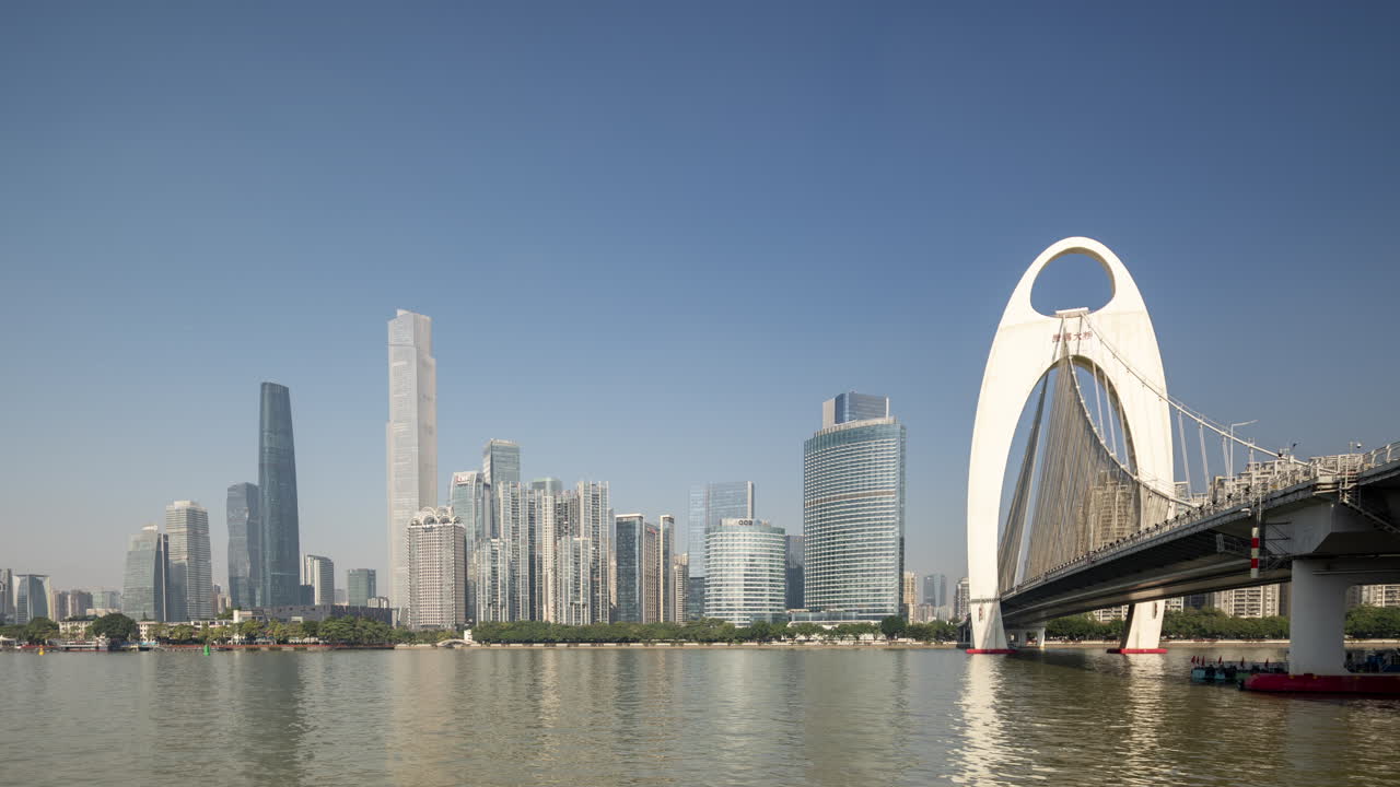 Guangzhou City Skyline with Modern Skyscrapers and Arch Bridge Over River