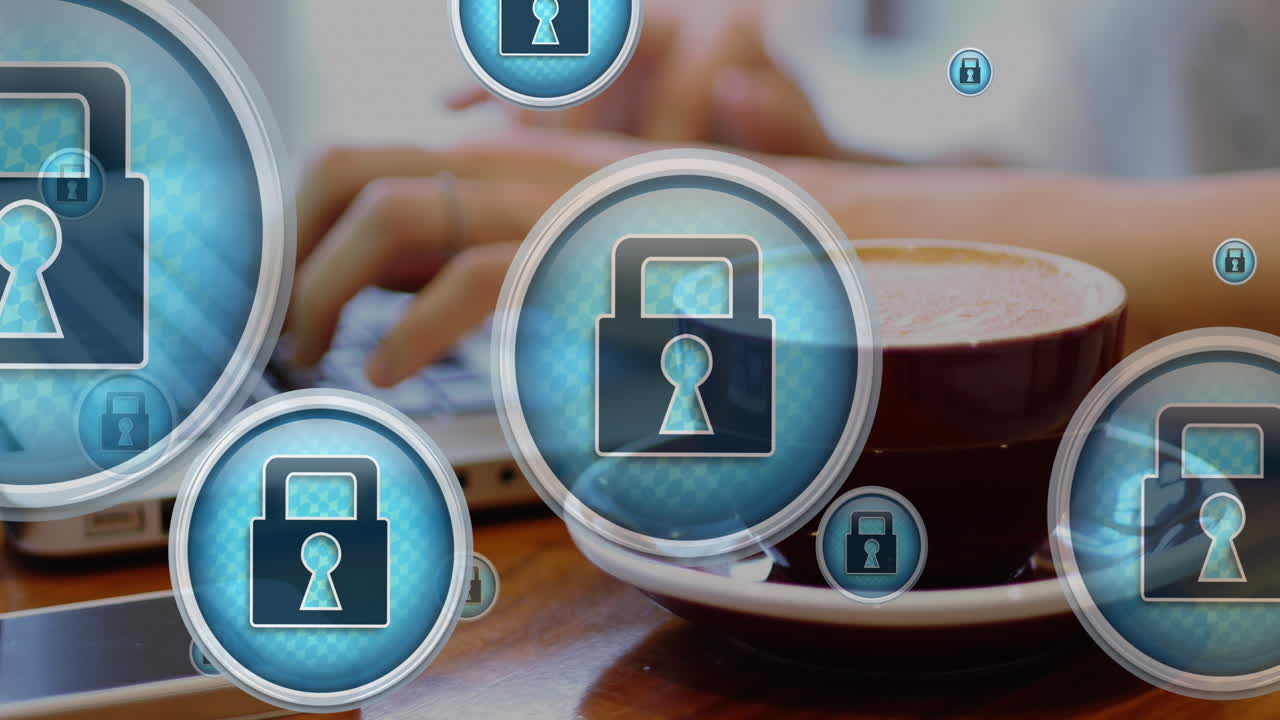 animación de iconos de candados, primer plano de una taza de café, sección media de un hombre caucásico trabajando en una computadora portátil