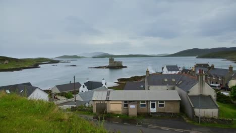 castlebay barra looking out to kisimul castle on a grey day