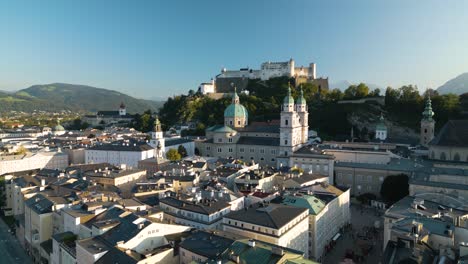 beautiful establishing shot of salzburg cathedral and hohensalzburg fortress