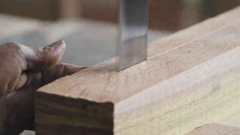 woodworking process with hand saw