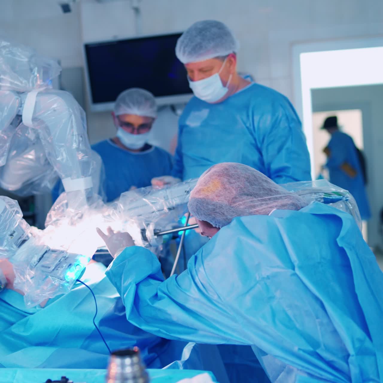 Team surgeon at work in operating room. Modern equipment in operating room. Surgical treatment of cancer