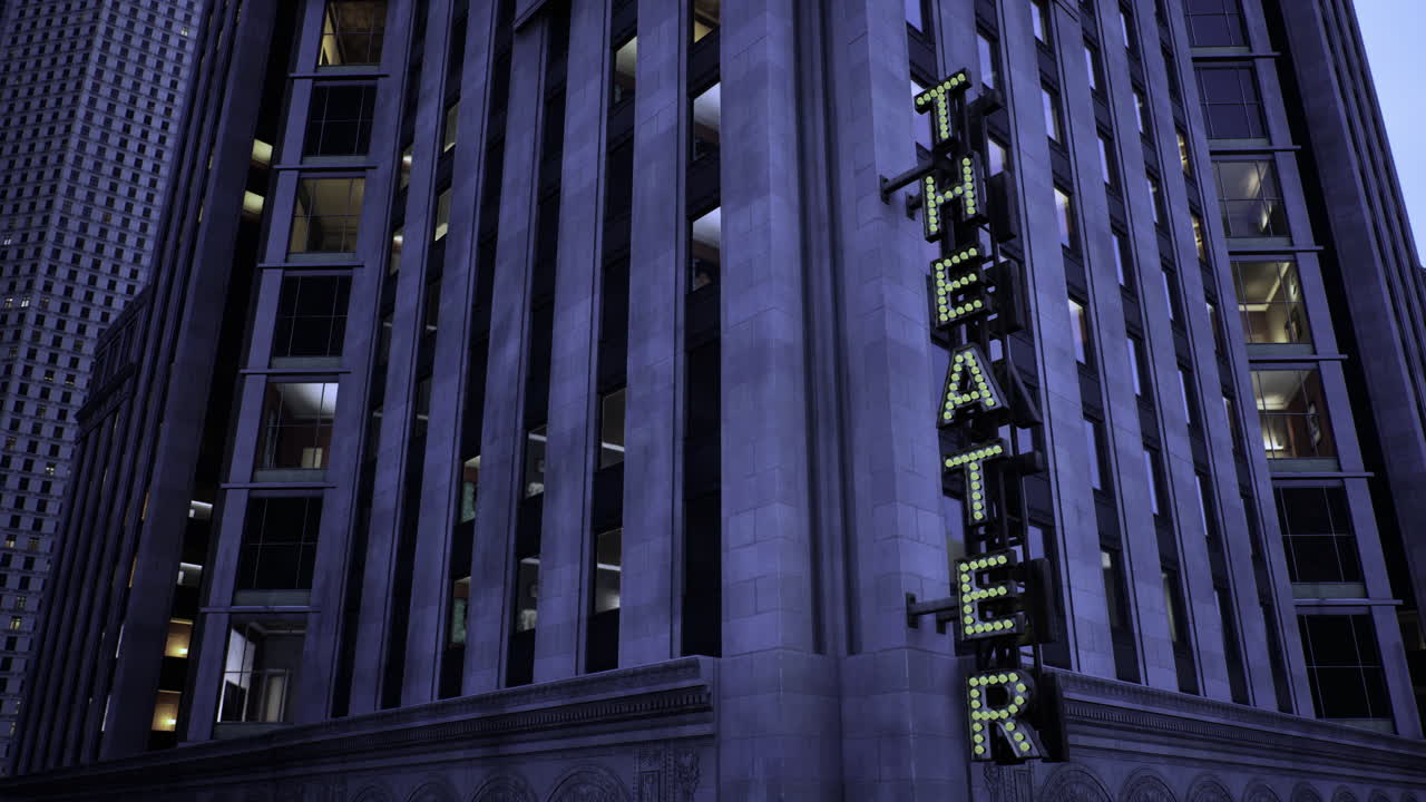 Bright lights illuminate the theater building in the city at dusk