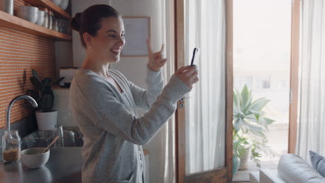 young-woman-having-video-chat-holding-smartphone-using-sign-language-chatting-to-deaf-friend-on-mobile-phone-at-home