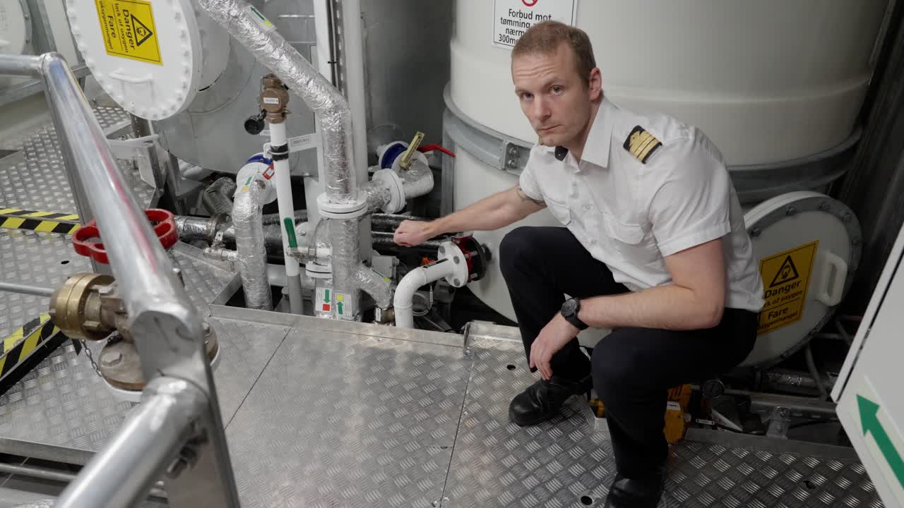 Captain show ship`s sewage tank and valve for discharge direct to sea