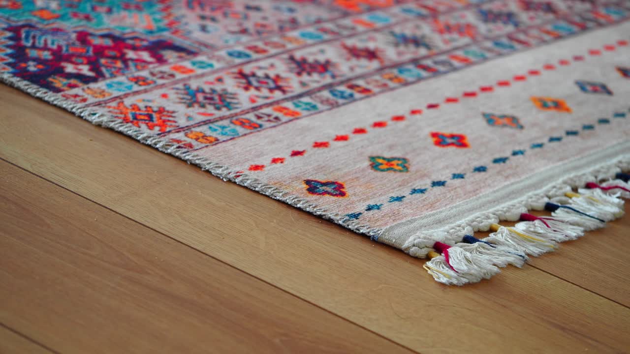 Colorful patterned rug on wood floor