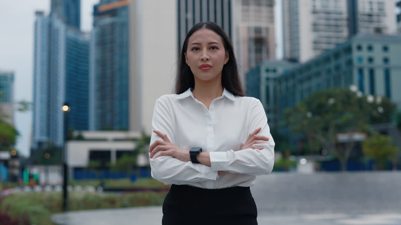 Confident Asian Businesswoman in Cityscape