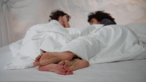 lovely couple laying on bed