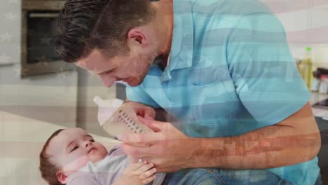 Animation-of-flag-of-usa-waving-over-happy-caucasian-father-trying-to-feed-baby