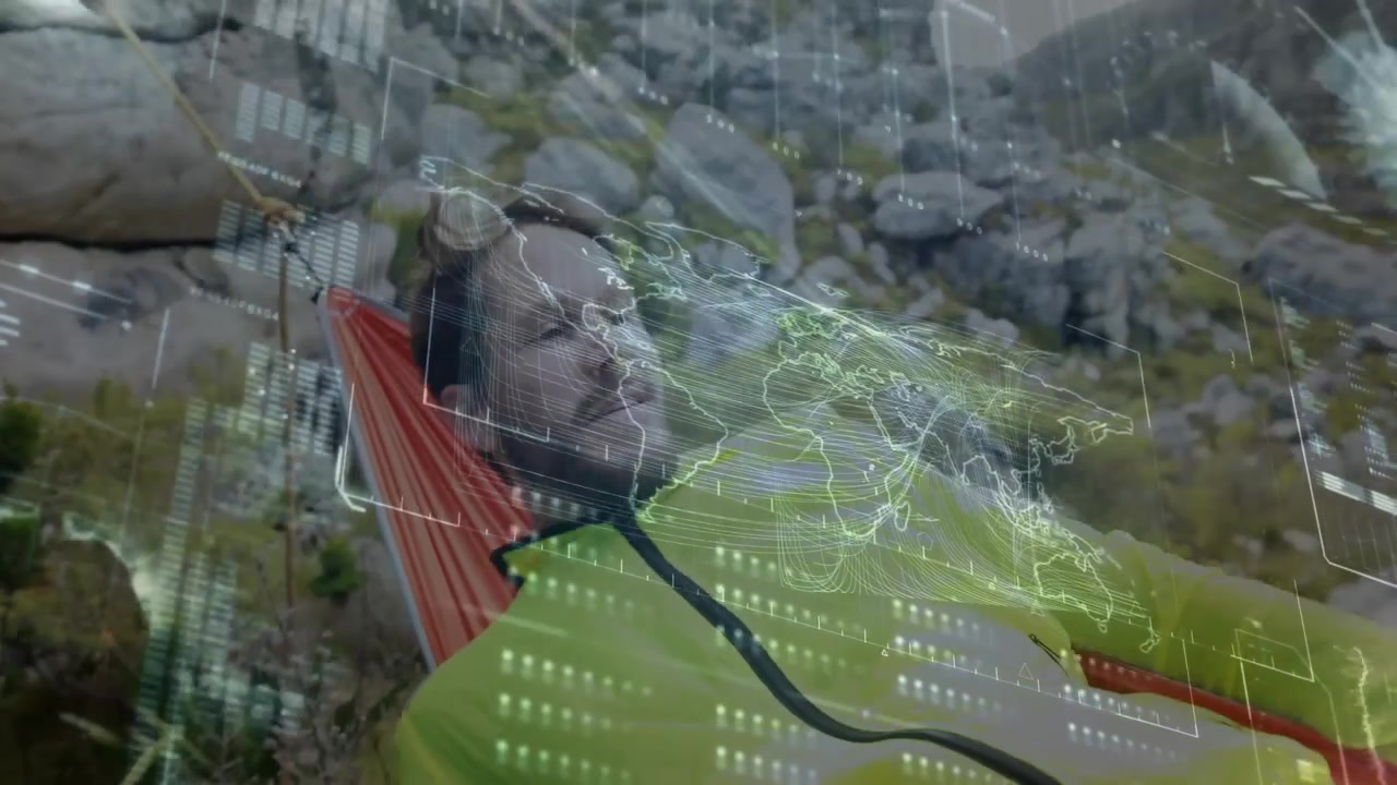 Mid adult man sitting hammock loading data on device and relaxing with pulsing world map overlay