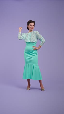 a woman in vintage-inspired fashion posing against a purple background