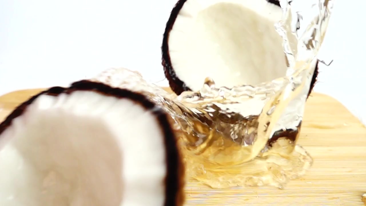 Falling ripe and juicy coconut. Slow motion.