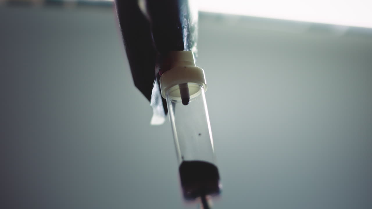 Dark liquid is dripping slowly