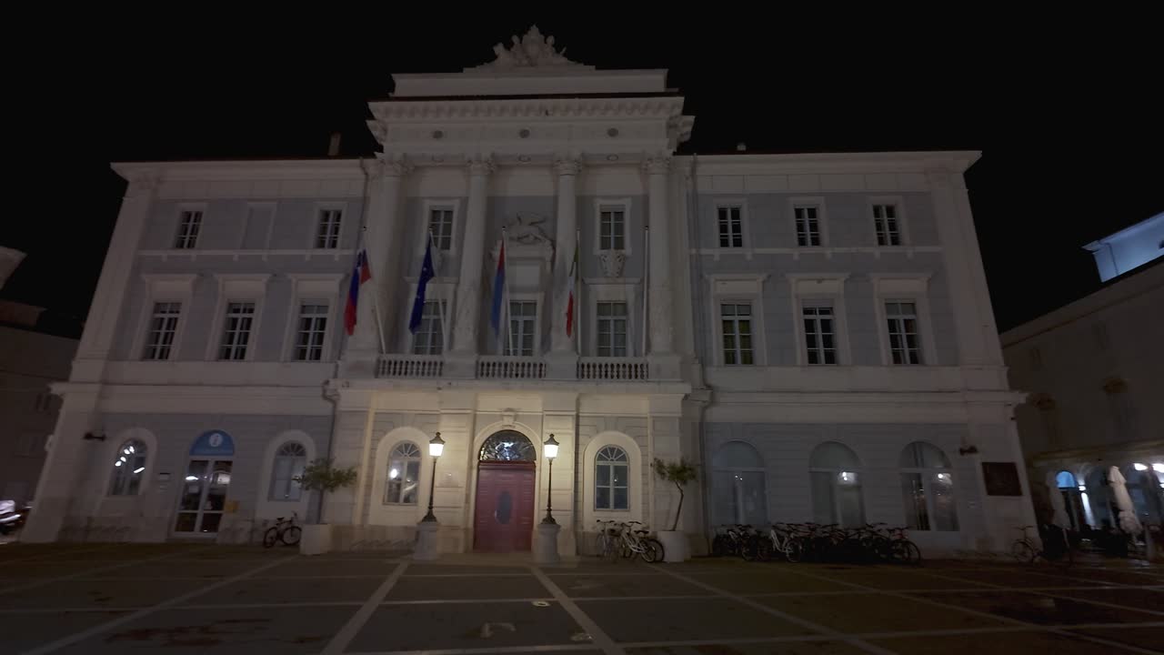 Town hall at Tartini Square In Piran, Slovenia At Night - Panning Shot