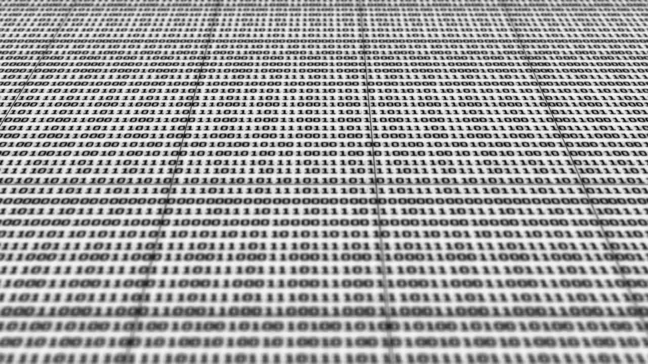 Scrolling black and white binary code