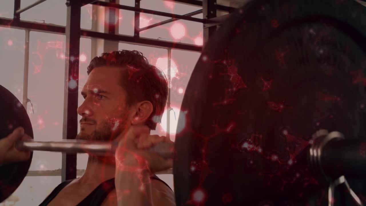 Male weightlifter pressing barbell from front-rack, fitness while red particles overlaying