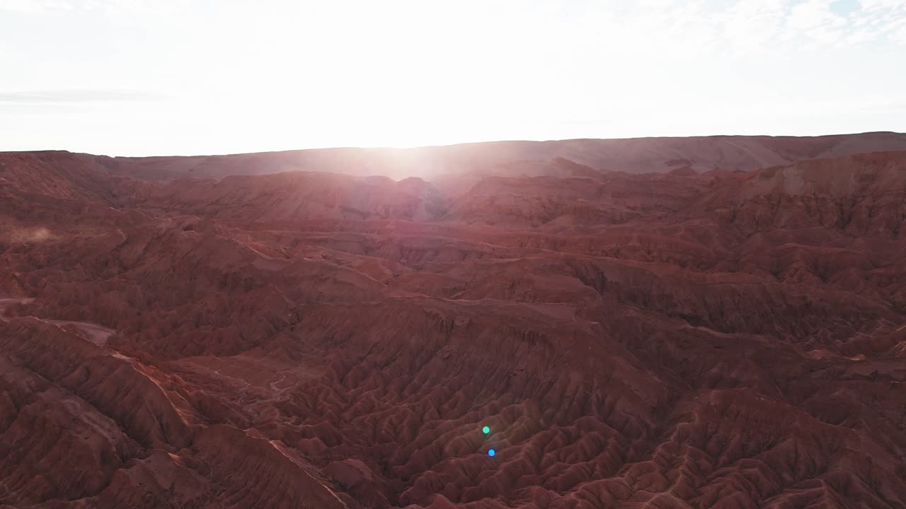 Aerial View of the Atacama Desert's Red Rock Formations at Sunset