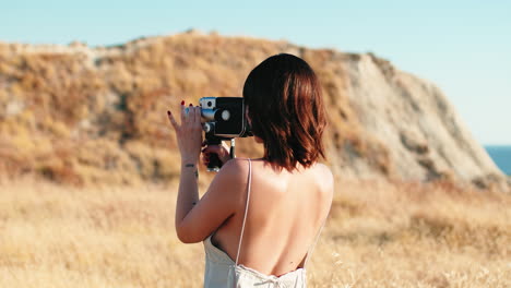 woman filming nature