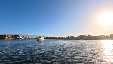 boat cruising along scenic gold coast river